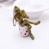 Skeleton sitting on a dice - keychainKeyrings
