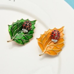 Brooch with beetle and leafBrooches