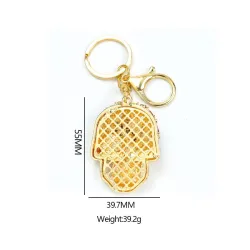 Golden keychain with crystal skullKeyrings