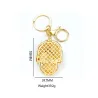 Golden keychain with crystal skullKeyrings