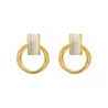 Elegant golden round earrings - with white opalEarrings