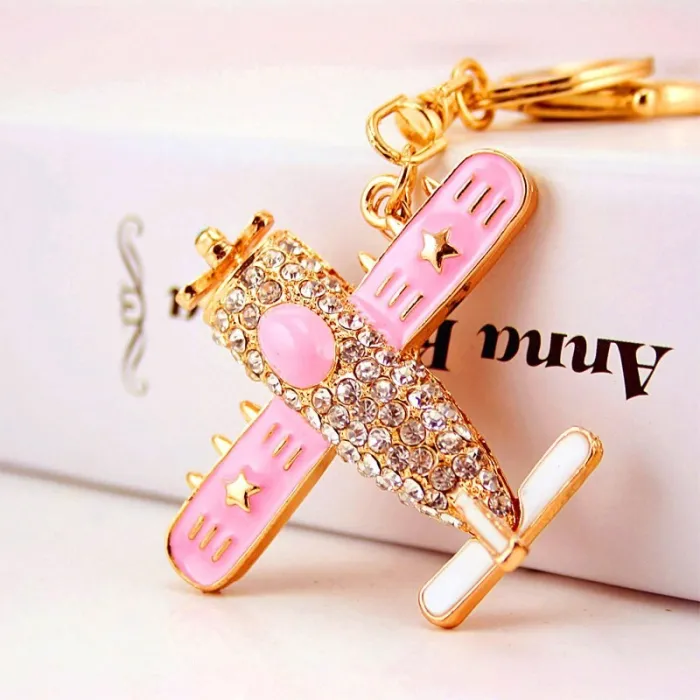 Crystal airplane - gold keychainKeyrings