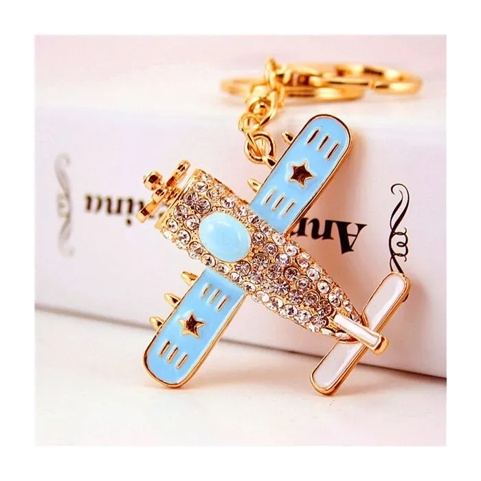 Crystal airplane - gold keychainKeyrings