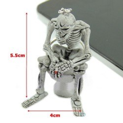 Skeleton sitting on the toilet - rubber keychainKeyrings